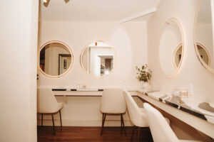 Makeup mirrors, chairs and counters in Bridal Cottage at Country Villa Weddings and Events.