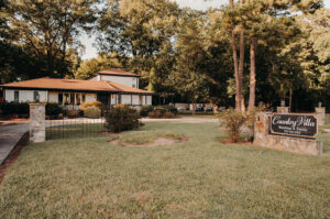 Outside entrance view with sign at Country Villa Weddings and Events.