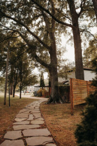Flagstone pathway leading to main house of Country Villa Weddings and Events.