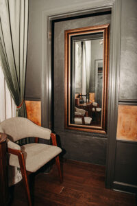 Full length mirror and chair in grooms' lounge at Country Villa Wedding and Events.